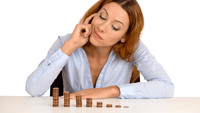How to Make Money Through Property Investment Woman Looking at Coins Image
